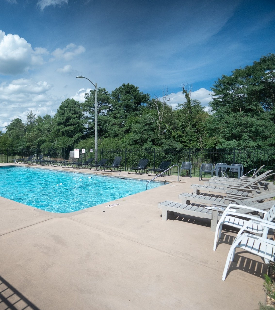 The pool and surrounding patio at The Bradford Apartments in Greer, South Carolina